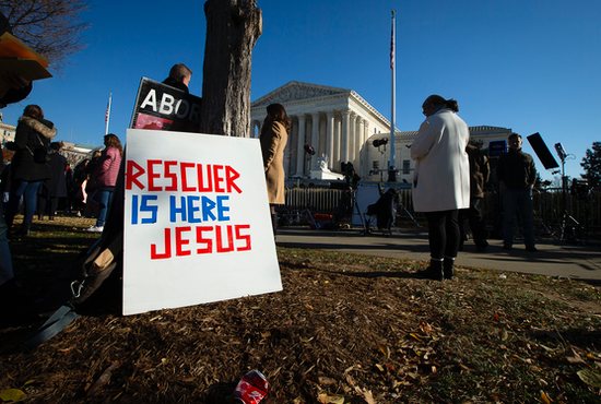 Pro-life advocates are seen near the U.S. Supreme Court Dec. 1, 2021, the day justices heard oral arguments in a case about a Mississippi law that bans abortions after 15 weeks of gestation.