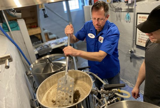 Jeffery Alcorn, head brewmaster, prepares mash for the Tridentine Brewing Co., in this undated photo.