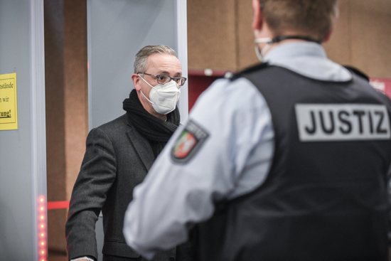 German Archbishop Stefan Hesse of Hamburg enters the security check on his way to the abuse trial at Cologne Regional Court Jan. 18, 2022. In the first testimony by a German bishop in an abuse trial, Archbishop Hesse admitted he made mistakes in his handling of a priest accused of abuse.