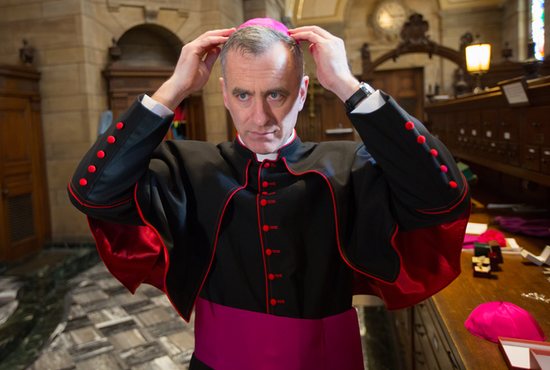 Bishop-elect Joseph Williams tries on his new vestments in the sacristy of the Cathedral of St. Paul in St. Paul Jan. 7.