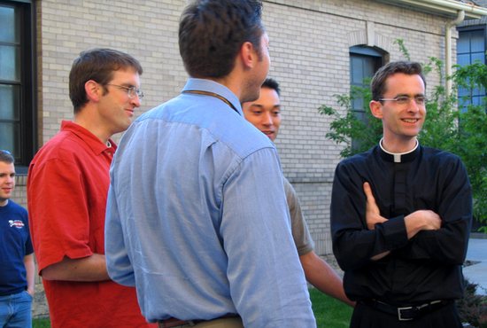 In this file photo from 2004, then-Father Joseph Williams gathers with young adults in the courtyard of the Cathedral of St. Paul in St. Paul.