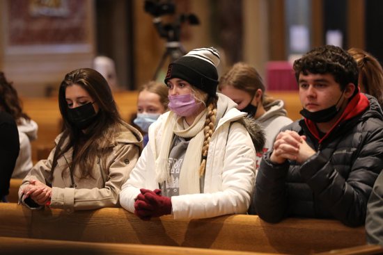 Young people pray during the annual Mass for Life sponsored by the Washington Archdiocese at the Cathedral of St. Matthew the Apostle in Washington Jan. 21, 2022.