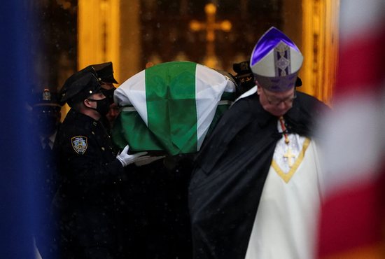 New York Cardinal Timothy Dolan is seen near the casket of Officer Jason Rivera of the New York Police Department at St. Patrick's Cathedral Jan. 28, 2022. Rivera was killed in the line of duty while responding to a domestic violence call.