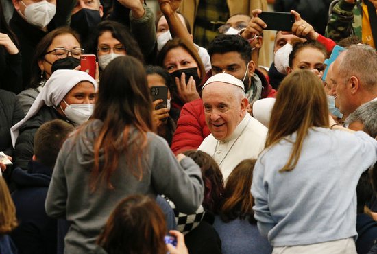 Pope Francis greets people as he leaves his general audience in the Paul VI hall at the Vatican Jan. 5, 2022.