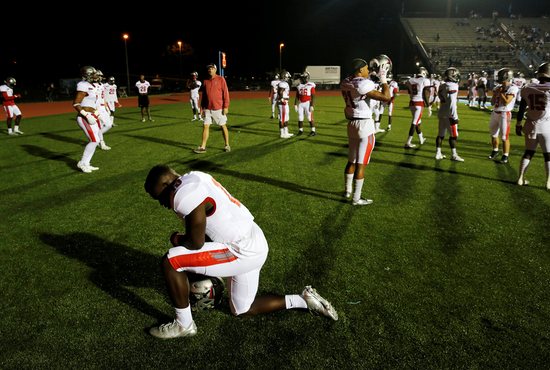 High school football players are seen in this illustration photo.