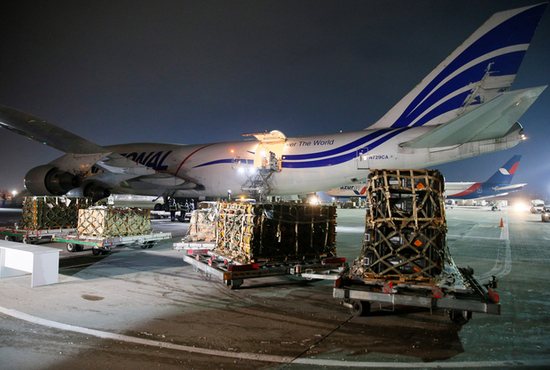 Workers unload a shipment of military aid delivered as part of the United States of America's security assistance to Ukraine, at the Boryspil International Airport outside Kyiv, Ukraine, Jan. 25, 2022.