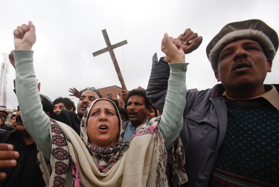 People from the Christian community attend a protest in Lahore, Pakistan, in this March 16, 2015, file photo. The protest was to condemn suicide bombings outside two churches in Lahore the previous day. Akash Bashir, a 20-year-old volunteer security guard who was killed in an attack outside a Catholic church, is the first Pakistani to be given the title "servant of God," an initial step on the path to sainthood.
