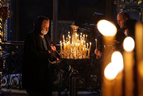 Worshippers light candles as they attend a prayer service at St. Michael's Cathedral of the Orthodox Church of Ukraine in Kyiv Feb. 20, 2022. Pope Francis expressed "great sorrow" over the situation in Ukraine and called on Christians to observe a day of prayer and fasting for peace on Ash Wednesday, March 2.
