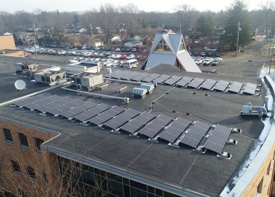 Solar panels sit on the roof of Cardinal Ritter Junior and Senior High School in Indianapolis Feb. 1, 2022. In addition to reducing the school's carbon footprint and utility costs, the panels are being integrated into its science and theology lesson plans.