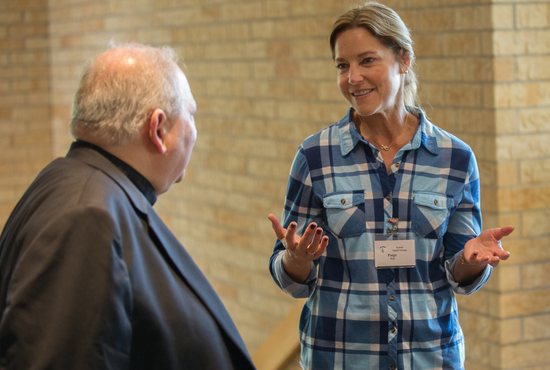 Paige Will of St. Hubert in Chanhassen talks with Archbishop Bernard Hebda during a Synod Small Group session Sept. 30 at St. Hubert.