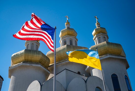 U.S. and Ukrainian national flags fly in solidarity outside St. Michael the Archangel Ukrainian Catholic Church in Baltimore Feb. 27, 2022.