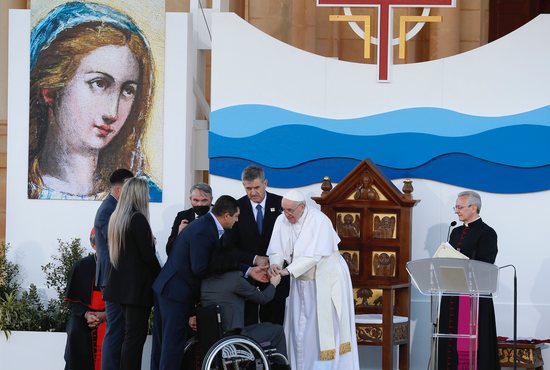 Pope Francis greets Sandi and Domenico Apap during a prayer meeting at the Ta' Pinu National Shrine in Gozo, Malta, April 2, 2022.