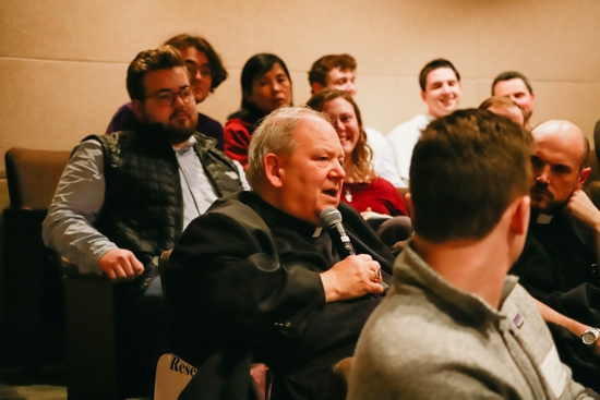 Archbishop Bernard Hebda answers a question from the audience at the panel discussion.