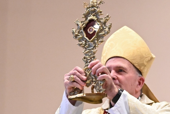 Bishop David M. O'Connell of Trenton, N.J., holds the reliquary containing the relic of Blessed Carlo Acutis during Mass at St. Dominic's Church April 28, 2022.