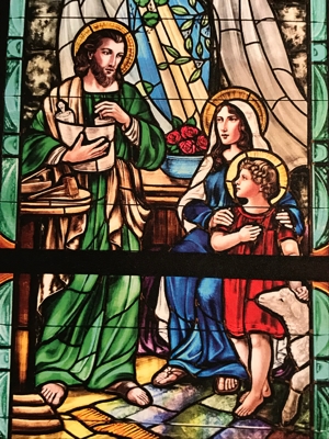 A stained glass window depicting Joseph, Mary and Jesus at St. Steven church in Anoka.