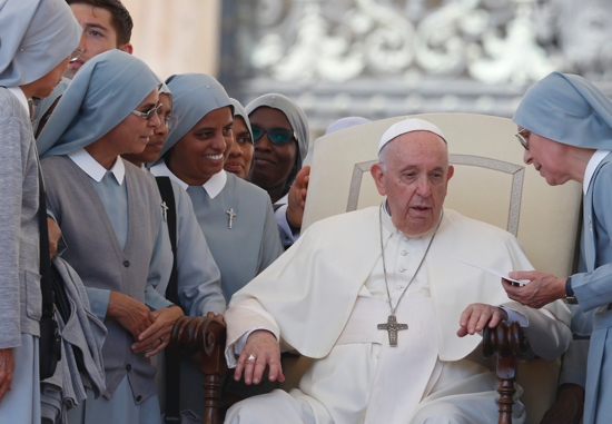 Pope Francis meets a group of nuns during his general audience in St. Peter's Square at the Vatican May 18, 2022.