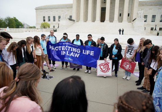 Abortion demonstrators are seen outside the U.S. Supreme Court in Washington May 3, 2022, after the leak of a draft majority opinion written by Justice Samuel Alito preparing for a majority of the court to overturn the landmark Roe v. Wade abortion rights decision later this year.