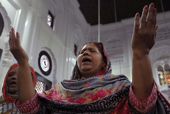 A Pakistani woman prays during a service at All Saints Church in Peshawar April 24, 2019. Church leaders in Pakistan are struggling to run parishes and educational institutions as inflation has reached record levels.