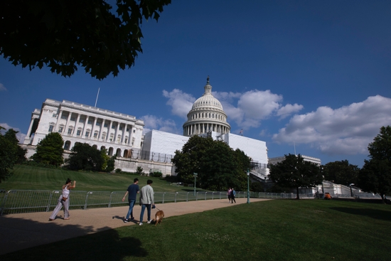 People are seen near the U.S. Capitol in Washington June 24, 2022. Earlier the same day the Supreme Court overruled the landmark Roe v. Wade abortion decision that legalized abortion nationwide in 1973.