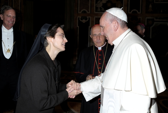 Pope Francis greets Sister Raffaella Petrini, an Italian member of the U.S.-based Franciscan Sisters of the Eucharist who is secretary-general of the office governing Vatican City State, at the Vatican Dec. 3, 2015.