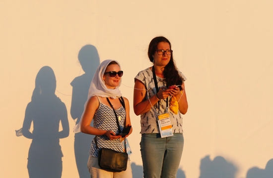 Young women attend the World Youth Day prayer vigil led by Pope Francis in Krakow, Poland, in this July 30, 2016, file photo. In a July 11 message to young people attending the "EU Youth Conference" in Prague, the pope said young men and women in Europe must look beyond "short-sighted ideologies" that are prevalent in today's world.