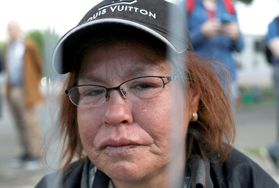 Misty Omeasoo of the Sampson Cree First Nation, who says she is a survivor from St. Augustine school in Ponoka, Alberta, cries while waiting to see Pope Francis in Edmonton July 25, 2022. During the meeting with First Nations, Métis and Inuit communities at Maskwacis, the pope apologized for the church's role in abuses at Canada's residential schools. 