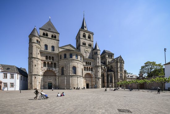 People walk outside the Cathedral of St. Peter and the Church of Our Lady in Trier, Germany, May 15, 2020. An independent commission on the reappraisal of abuse in the Diocese of Trier presented its first interim report Aug. 25, 2022.