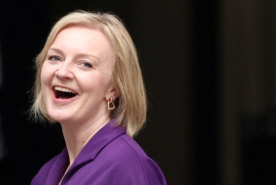 Liz Truss smiles as she arrives at the Conservative Party headquarters in London Sept. 5, 2022, after being announced as the new British prime minister. Cardinal Vincent Nichols of Westminster congratulated Truss and urged her to immediately halt the country's declining living standards.
