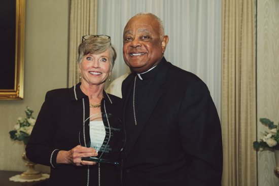 Karen Clifton, founder of Catholic Mobilizing Network, stands with Washington Cardinal Wilton D. Gregory at the Vatican Embassy in Washington Oct. 10, 2022, which was the World Day Against the Death Penalty. The cardinal received the Archbishop Fiorenza Dignity and Life Award during a ceremony sponsored by Catholic Mobilizing Network, a national Catholic organization working to end the death penalty and promote restorative justice.