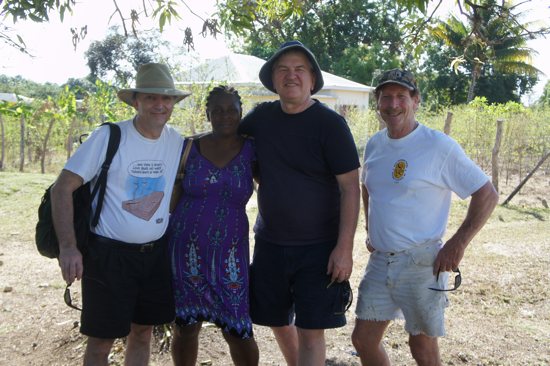 Grant Rabuse, right, a member of St. Joseph in West St. Paul, stands with a woman for whom he helped build a house in February 2016, as well as fellow immersion trip delegate and friend Bob Doyle, in Black River, Jamaica.