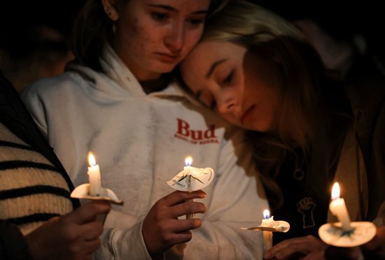 People in Colorado Springs, Colo., attend a vigil Nov. 20, 2022, after a mass shooting at Club Q, a LGBTQ nightclub. At least five people were killed and 25 others injured by a 22-year-old gunman who entered the nightclub just before midnight Nov. 19 and immediately opened fire. The shooting lasted just minutes before patrons confronted and stopped the suspected shooter, identified as 22-year-old Anderson Lee Aldrich.