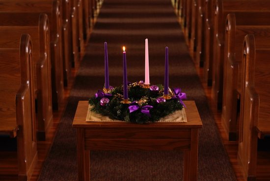 A lit candle is seen on a wreath for the first Sunday of Advent in this illustration photo. The wreath, which holds four candles, is a main symbol of the Advent season, with a new candle lit each Sunday before Christmas. Advent, a season of joyful expectation, begins Nov. 27, 2022. 
