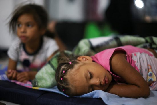 A girl sleeps in a shelter set up for Venezuelan migrants in the Church Our Lady of the Solitude in Mexico City Nov. 3, 2022.