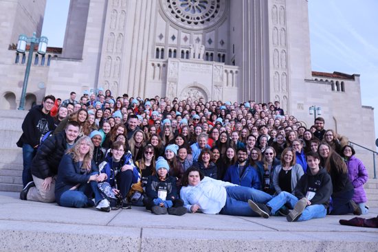 Pilgrims from the archdiocese on the March for Life in 2020 pose for a photo in front of the Basilica of the National Shrine of the Immaculate Conception in Washington. 