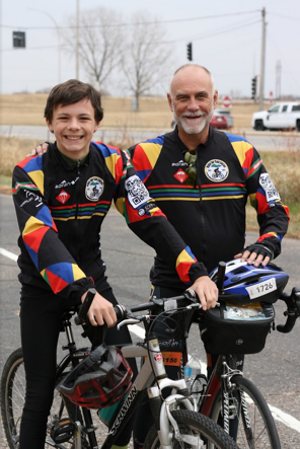 Mitchell Gibbs, left, and Dan Herbeck biked 15 miles together on a trail near Faribault Nov. 3. Herbeck gave Gibbs a bicycle shirt that matched his own, with the logo for the commemorative bike ride and sponsors for the ride.