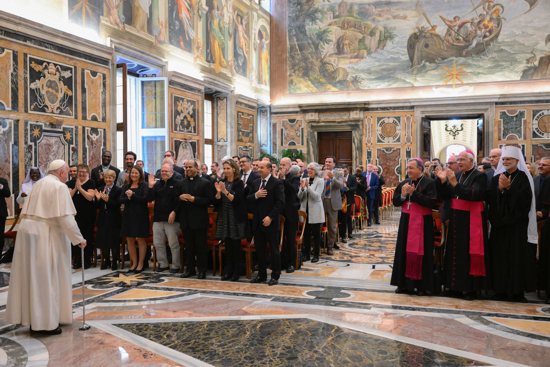Members, consultants and staff of the Vatican Dicastery for Communication applaud Pope Francis during an audience Nov. 12, 2022, in the Clementine Hall of the Apostolic Palace at the Vatican.