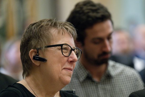 Helen Osman, president of Signis, the World Catholic Association for Communication, listens to Pope Francis at an audience with members, consultants and staff of the Dicastery for Communication Nov. 12, 2022.