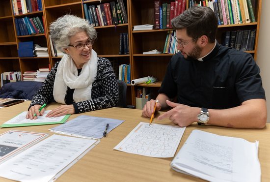 Dunia Ruff works with seminarian Cullen Gallagher of the Diocese of Winona-Rochester Nov. 30 at The St. Paul Seminary in St. Paul. 