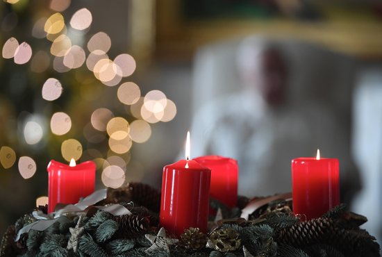 An Advent wreath is seen in the library of the Apostolic Palace at the Vatican Dec. 23, 2020, as Pope Francis leads his weekly general audience.