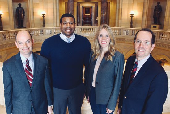 Jason Adkins, left, executive director and general counsel; Ryan Hamilton, government relations associate; Maggee Hangge, policy and public relations associate; and Lynn Varco, policy and engagement associate, members of the policy team of Minnesota Catholic Conference, at the State Capitol. 