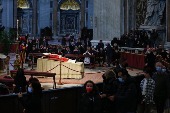 People pay their respects at the body of Pope Benedict XVI in St. Peter's Basilica at the Vatican Jan. 4, 2023. 