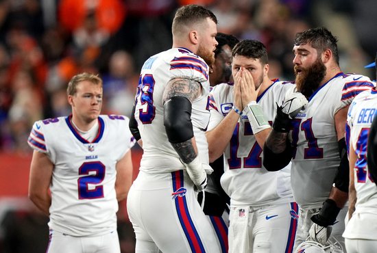 Buffalo Bills quarterback Josh Allen (17) reacts as Bills safety Damar Hamlin is administered CPR after a collision in a game against the Cincinnati Bengals at Paycor Stadium in Cincinnati Jan. 2, 2023. Hamlin, an alum of Central Catholic High School in Pittsburgh, was hospitalized in critical condition after suffering cardiac arrest following the collision.