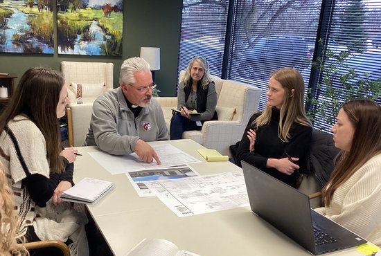 Father Tom Margevicius, director of worship for the Archdiocese of St. Paul and Minneapolis, consults with the architectural team and St. Therese staff working on a chapel for senior living facility St. Therese of Corcoran.
