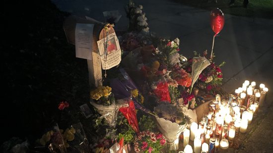 A makeshift memorial is seen outside the home of Los Angeles Auxiliary Bishop David G. O'Connell in Hacienda Heights Feb. 20, 2023, hours after investigators announced an arrest in his murder. 