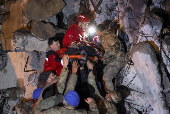 Cennet Sucu is rescued from the rubble of collapsed hospital following an earthquake in Iskenderun, Turkey, Feb. 6, 2023. A powerful 7.8 magnitude earthquake rocked areas of Turkey and Syria early that morning, toppling hundreds of buildings and killing more than 2,800 people.