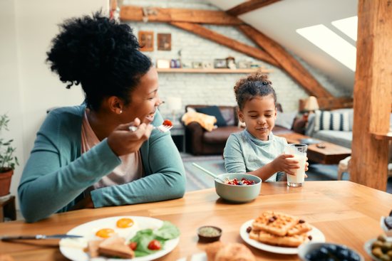 Family talking at breakfast table