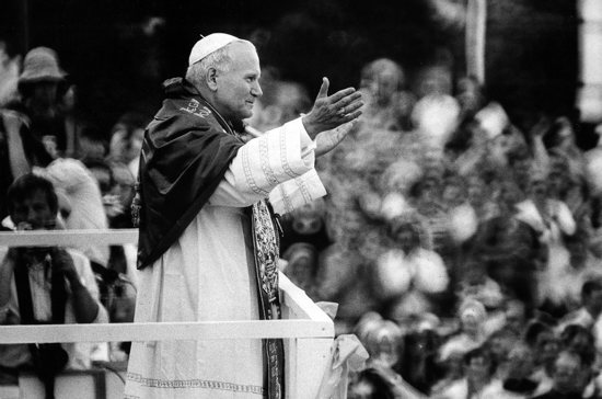 St. John Paul II greets the crowd in Czestochowa during his 1979 trip to Poland. The country's bishops March 15, 2023, announced they will create a commission of experts to investigate cases of abuse of minors by clergy from the past -- an investigation that would cover the era that Cardinal Karol Wojtyla, the future pope, governed the Archdiocese of Krakow. The bishops also defended the late pope after a Polish TV station report said there was a "cover up" of abuse when Cardinal Wojtyla was Krakow's archbishop.