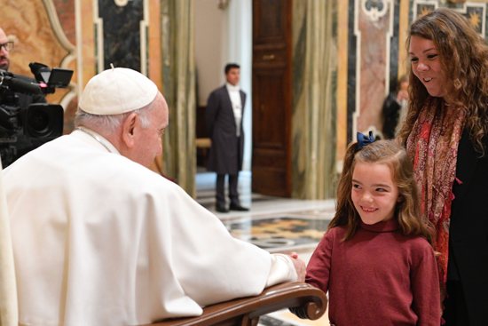 Pope Francis greets a child during an audience with the Mother of Hope of Talavera de la Reina Foundation, part of the Archdiocese of Toledo, Spain, at the Vatican April 15, 2023.