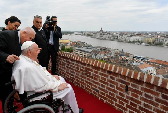 Pope Francis is accompanied by Prime Minister Viktor Orbán and President Katalin Novák to see a view of the city of Budapest and the Danube River from the terrace at the former Carmelite monastery that now houses the office of the prime minister April 28, 2023. He had just given his first speech in Hungary to government and civic leaders and diplomats serving in Budapest.