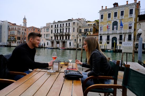 A couple enjoys drinks at a bar in Venice, Italy, April 26, 2021. As studies show Catholic marriage vocations are way down amid a wider crisis in dating culture, single Catholics are creating other options to meet each other.